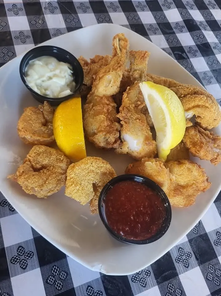 Hand-breaded fried catfish basket with lemon and dipping sauces